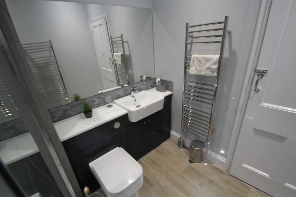 Bathroom sink against mirror