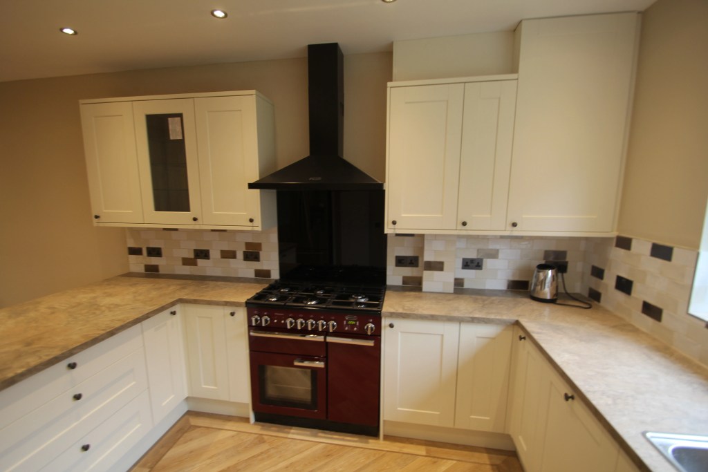 Modern kitchen designed around a red rangemaster